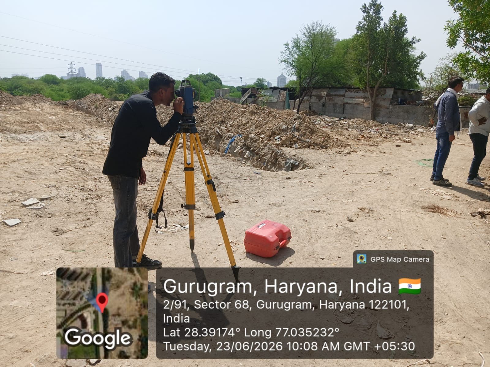 A surveyor taking levels with an instrument on a tripod