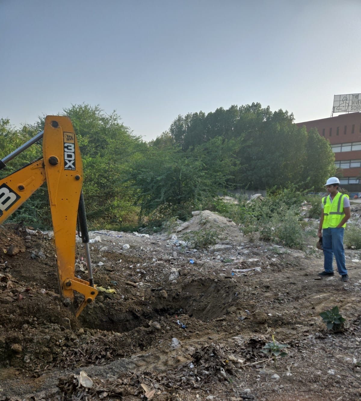 An excavator begins digging at the Badshahpur Pond site, 22 April 2026